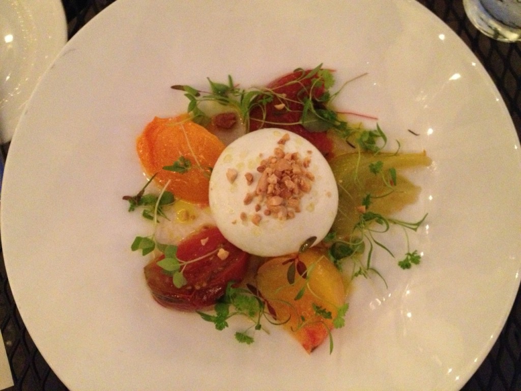confit heirloom tomatoes with a mozzarella balloon injected with English pea espuma & topped with toasted peanuts at M Restaurant (photo by Lee Porter)