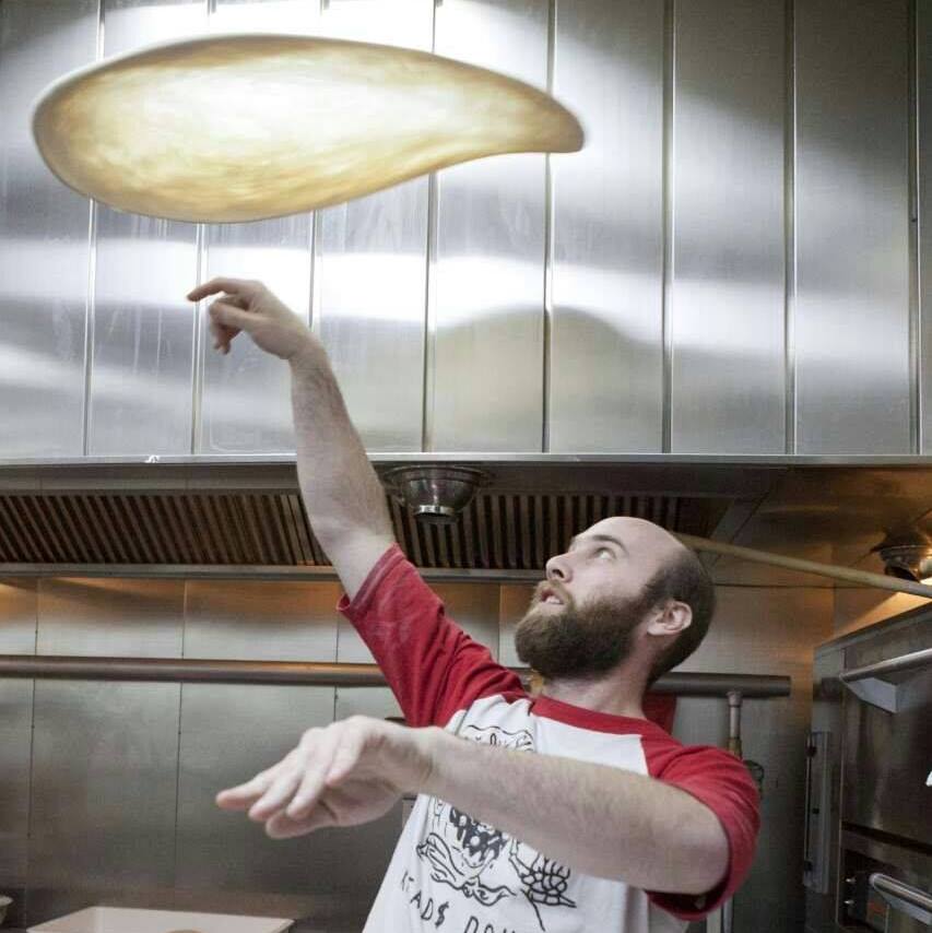 Gutter spinning dough at Pizza Brain (photo courtesy of Gutter)